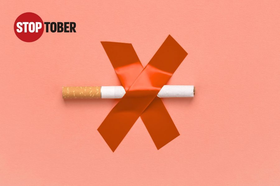 a cigarette taped to a wall